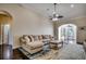 Spacious living room boasting an open floor plan, arched doorways, and hardwood floors at 109 Pheasant Run Dr., Murrells Inlet, SC 29576