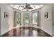 Bright sun room with skylights, hardwood floors, and a ceiling fan at 109 Pheasant Run Dr., Murrells Inlet, SC 29576