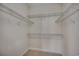 An empty walk-in closet with shelving and carpeted flooring for your storage needs at 109 Pheasant Run Dr., Murrells Inlet, SC 29576