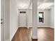 Inviting entryway with hardwood floors, white trim, and modern lighting fixtures at 1095 Nw Forest Bend Dr., Calabash, NC 28467