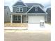 Charming two-story home with a well-manicured lawn and an attached two-car garage at 1095 Nw Forest Bend Dr., Calabash, NC 28467