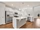 Spacious kitchen with stainless steel appliances, white cabinets, and a center island at 1095 Nw Forest Bend Dr., Calabash, NC 28467