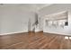 Bright living room with wood-look floors overlooks the kitchen and features an open staircase at 1095 Nw Forest Bend Dr., Calabash, NC 28467