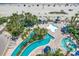 Aerial view of an outdoor pool with lazy river, sunbathing area and beach in the background at 1105 S Ocean Blvd. # 502, Myrtle Beach, SC 29577