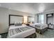 Bright bedroom featuring two beds, an ocean view and a closet at 1105 S Ocean Blvd. # 502, Myrtle Beach, SC 29577