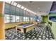 Bright game room featuring pool tables and a vibrant mural, perfect for entertaining guests at 1105 S Ocean Blvd. # 502, Myrtle Beach, SC 29577