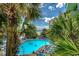 Beautiful pool area with lounge chairs, palm trees, and ocean views at 1105 S Ocean Blvd. # 502, Myrtle Beach, SC 29577