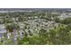 An aerial view of a residential community featuring a lake and plenty of trees at 1130 Ganton Way, Myrtle Beach, SC 29588