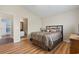 Bedroom showcasing a coordinated bed set with a view of an ensuite bathroom at 1130 Ganton Way, Myrtle Beach, SC 29588