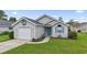 Charming one-story home featuring vinyl siding, a garage, and a well-maintained front lawn at 1130 Ganton Way, Myrtle Beach, SC 29588