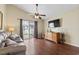 Inviting living room with hardwood floors and sliding glass doors to backyard at 1130 Ganton Way, Myrtle Beach, SC 29588