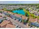 Aerial view of condo building, showcasing a scenic pond and lush landscaping throughout the community at 117 Butkus Dr. # 5, Myrtle Beach, SC 29588