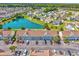 Aerial view of condo building complex showing lush landscaping, scenic pond, and community setting at 117 Butkus Dr. # 5, Myrtle Beach, SC 29588