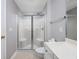 Bright bathroom features a glass enclosed shower with built in seating and updated fixtures at 117 Butkus Dr. # 5, Myrtle Beach, SC 29588