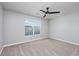 Bright bedroom featuring neutral walls, carpet, and a ceiling fan providing a relaxing atmosphere at 117 Butkus Dr. # 5, Myrtle Beach, SC 29588