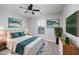 Comfortable bedroom featuring a well-made bed, stylish artwork, and lots of natural light at 117 Butkus Dr. # 5, Myrtle Beach, SC 29588