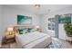 Comfortable bedroom featuring a well-made bed, stylish artwork, and lots of natural light at 117 Butkus Dr. # 5, Myrtle Beach, SC 29588