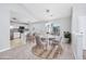 Open dining area features a modern chandelier, neutral walls, and kitchen views at 117 Butkus Dr. # 5, Myrtle Beach, SC 29588