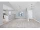 Bright dining area has modern chandelier and neutral walls with kitchen views at 117 Butkus Dr. # 5, Myrtle Beach, SC 29588