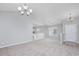 Open dining area with modern chandelier and neutral walls provides a seamless flow at 117 Butkus Dr. # 5, Myrtle Beach, SC 29588
