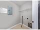 Functional laundry room with tile floor, overhead shelving, and utility connections at 117 Butkus Dr. # 5, Myrtle Beach, SC 29588