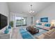 Bright living room boasts vaulted ceilings, slider to balcony, and neutral decor at 117 Butkus Dr. # 5, Myrtle Beach, SC 29588