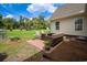 Charming back patio with comfortable seating, brick accents, and lush landscaping at 120 Wraggs Ferry Rd., Georgetown, SC 29440