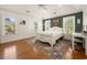 Inviting bedroom with hardwood floors, a tray ceiling, natural light, and charming decor accents at 120 Wraggs Ferry Rd., Georgetown, SC 29440