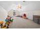 Spacious bonus room features neutral carpeting and a large arched window at 120 Wraggs Ferry Rd., Georgetown, SC 29440