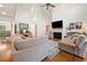 Bright living room featuring high ceilings, fireplace, and comfortable seating at 120 Wraggs Ferry Rd., Georgetown, SC 29440