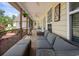 Inviting screened porch with plush outdoor seating and serene views of the backyard and greenery at 120 Wraggs Ferry Rd., Georgetown, SC 29440