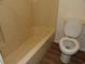 Standard bathroom featuring a tub and toilet with vinyl flooring at 1208 Mackie Circle, Myrtle Beach, SC 29579