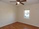 Bedroom features wood flooring, a window with natural light, and a ceiling fan for a comfortable and inviting atmosphere at 1208 Mackie Circle, Myrtle Beach, SC 29579