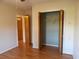 Bedroom offers wood flooring, closet, and ample natural light, creating a comfortable retreat within the home at 1208 Mackie Circle, Myrtle Beach, SC 29579