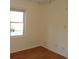 Clean bedroom features wood flooring, neutral walls, a window for natural light, and a ceiling fan for added comfort at 1208 Mackie Circle, Myrtle Beach, SC 29579