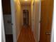 Hallway featuring light wood flooring and neutral walls, creating a seamless transition between rooms and spaces at 1208 Mackie Circle, Myrtle Beach, SC 29579