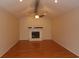 Living room featuring a brick fireplace, ceiling fan, and wood flooring at 1208 Mackie Circle, Myrtle Beach, SC 29579