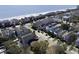 Community aerial view, displaying homes near the ocean with views of sandy beach and ocean at 1210 A S Ocean Blvd., Surfside Beach, SC 29575