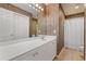Bathroom featuring wood-look wall paper, and extended counter and vanity at 1210 A S Ocean Blvd., Surfside Beach, SC 29575