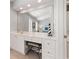 Bathroom vanity with a large mirror and natural light overlooking the bedroom at 1210 A S Ocean Blvd., Surfside Beach, SC 29575