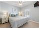 Bright bedroom with a king-sized bed, neutral walls, and plantation shutters allowing natural light at 1210 A S Ocean Blvd., Surfside Beach, SC 29575