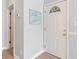 Charming entryway with wood-look flooring, decorative sign, and a white door with decorative window at 1210 A S Ocean Blvd., Surfside Beach, SC 29575