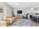 Inviting living room with ceiling fan, light walls, wood floors, and comfortable seating arrangement at 1210 A S Ocean Blvd., Surfside Beach, SC 29575