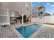 Inviting outdoor pool area with brick paver decking and covered seating, perfect for relaxing and entertaining at 1210 A S Ocean Blvd., Surfside Beach, SC 29575