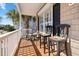 Inviting porch seating area with barstool seating and rocking chair, perfect for relaxing outdoors at 1210 A S Ocean Blvd., Surfside Beach, SC 29575