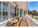 Charming covered porch with outdoor seating, creating a cozy and inviting outdoor space at 1210 A S Ocean Blvd., Surfside Beach, SC 29575