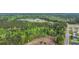 Aerial view of a neighborhood surrounded by dense green forests, showcasing a serene and private community at 1340 Valor Rd., Conway, SC 29527