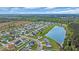 Expansive aerial view of a residential neighborhood with a pond and well-maintained lawns at 1340 Valor Rd., Conway, SC 29527