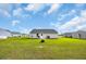 Spacious backyard featuring lush green grass, providing ample room for outdoor activities and relaxation at 1340 Valor Rd., Conway, SC 29527