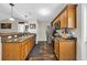This kitchen features wood cabinets, granite countertops, and stainless steel appliances at 1340 Valor Rd., Conway, SC 29527